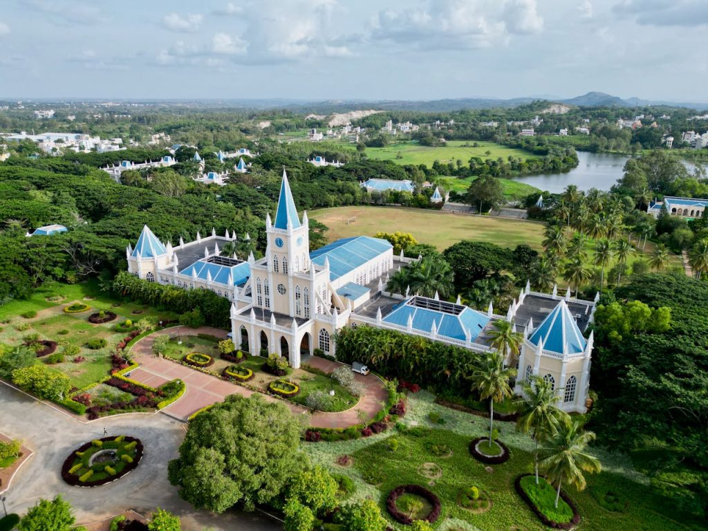Aerial view of the picturesque Sarala Birla Academy set amidst green landscapes in Bengaluru, India.